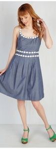 Denim dress with ivory flower